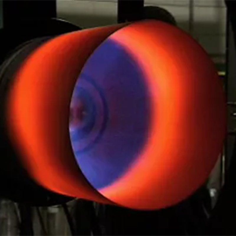 How does a low-NOx emission burner reduce NOx emissions by adjusting airflow?